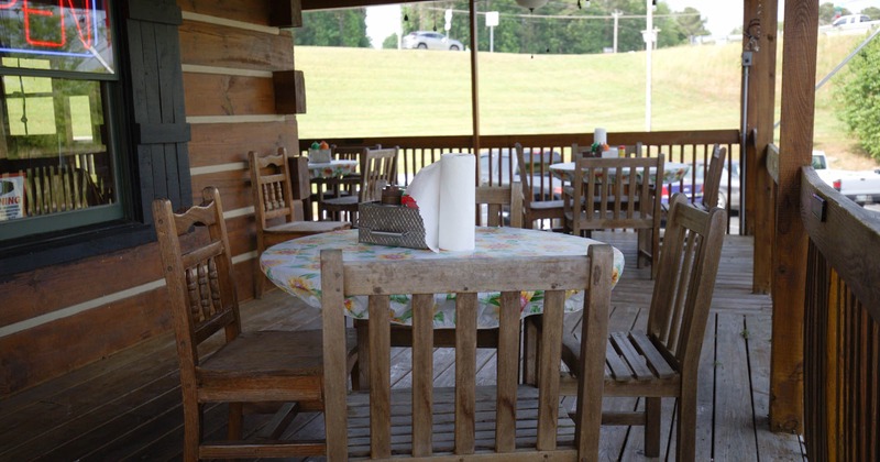 Exterior, porch seating and tables