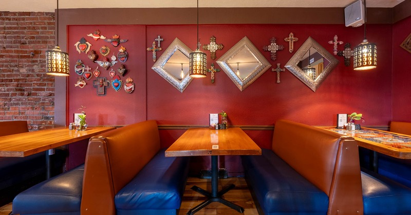 Interior, booths with tables beside the wall