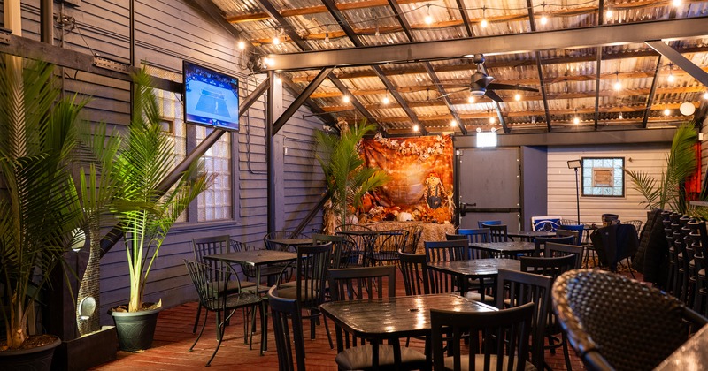 Warm and cozy enclosed patio space seating area, perfect for private parties