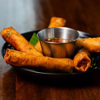 Crispy pork rolls with sweet and sour chili sauce.