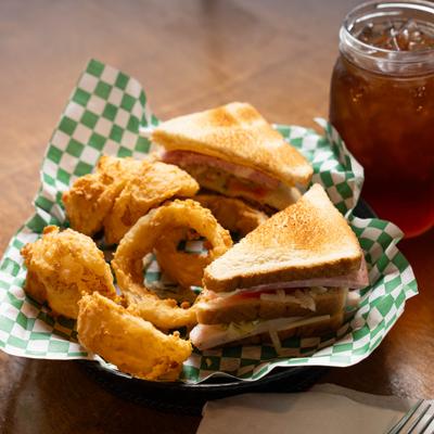 Club sandwiches and onion rings.