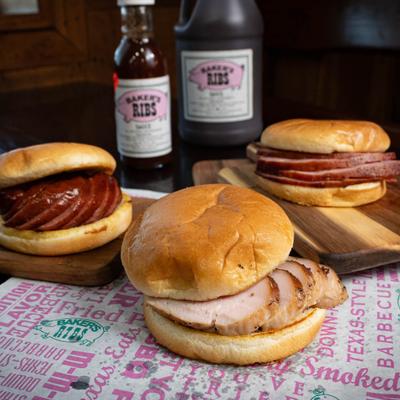 Turkey breast, sausage, and ham sandwiches on soft buns.