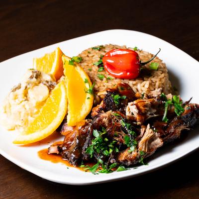 Pork marinated in jerk seasoning and BBQ sauce, served with rice.