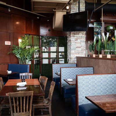 Dining area with tables, chairs and booths.
