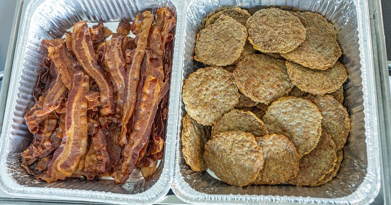 Serving containers with bacon and sausage