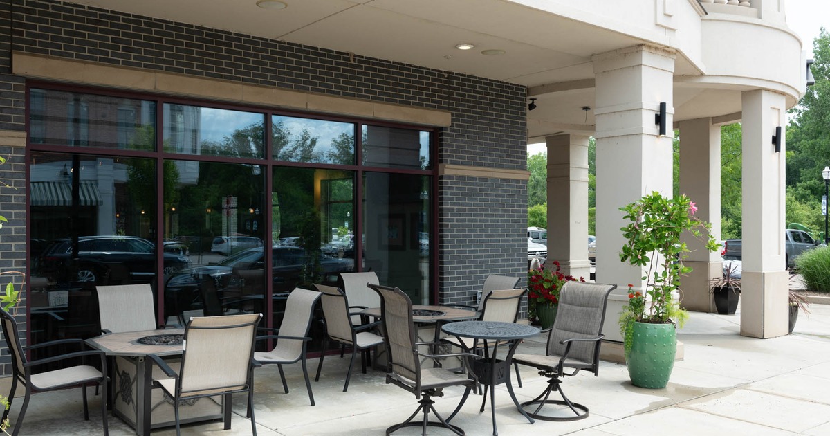 Exterior seating area with chairs and tables