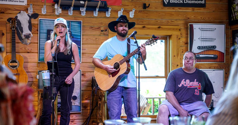 Three musicians performing indoors