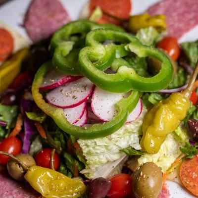 Dinner Salad, blend of greens, red cabbage, carrots and tomatoes.
