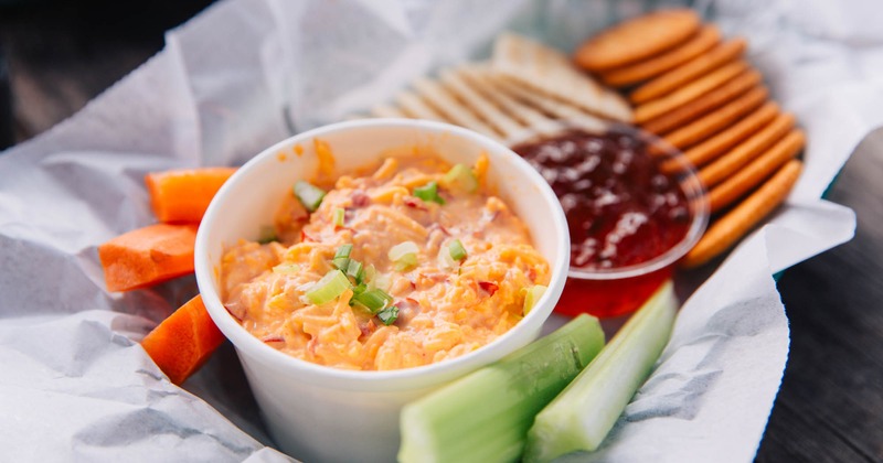 Pimento cheese served with carrots, celery, crackers and habanero jelly