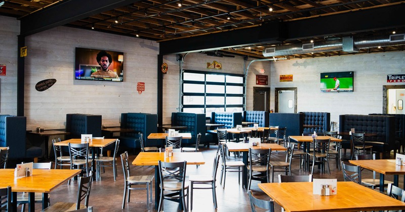 Interior, wide view, dining area, tables and chairs ready for guests