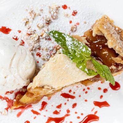 Apple Strudel served with a scoop of ice cream.