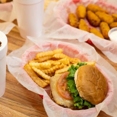 Chicken Cordon Bleu sandwich with fries on the side.