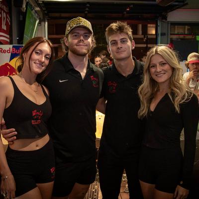 People hugging for a photo.