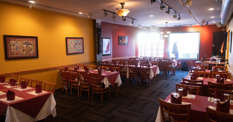 Interior, tables set up for four, eight and ten, ready for guests, carpet flooring