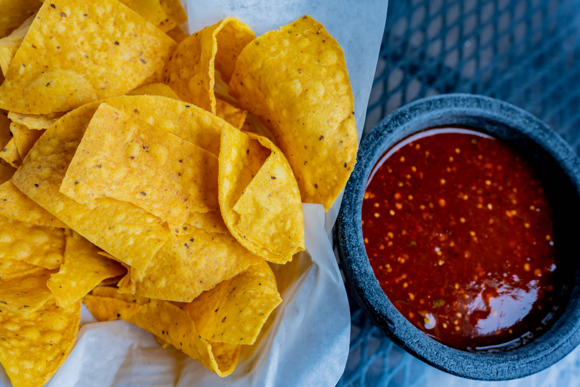 Corn chips and red salsa, top view