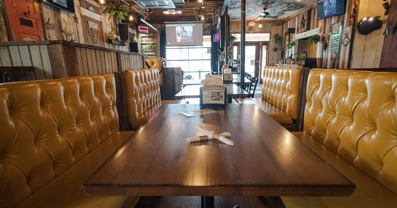 Dining area, button tufted banquette seating with tables