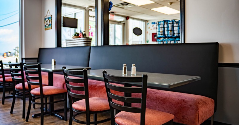 Interior,  banquette seating and tables ready for guests