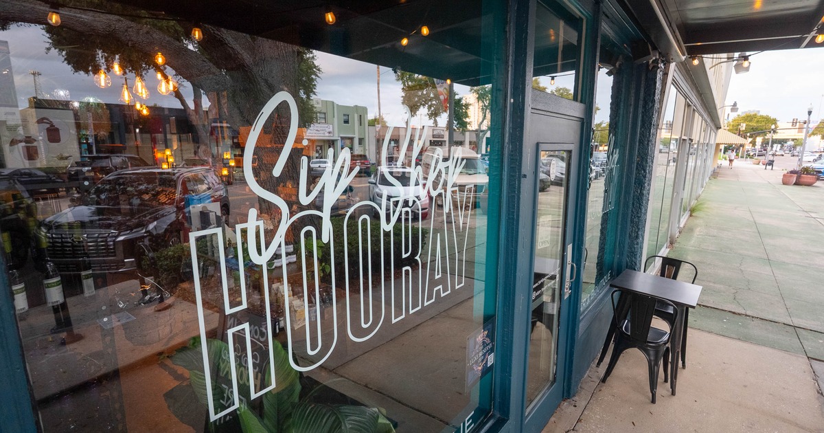 Sip Shop Hooray logo on the window