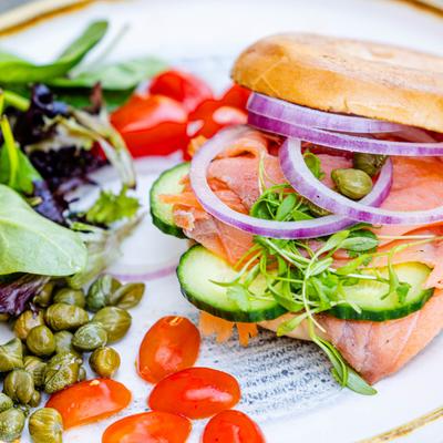 Smoked salmon bagel, served, front view, closeup.