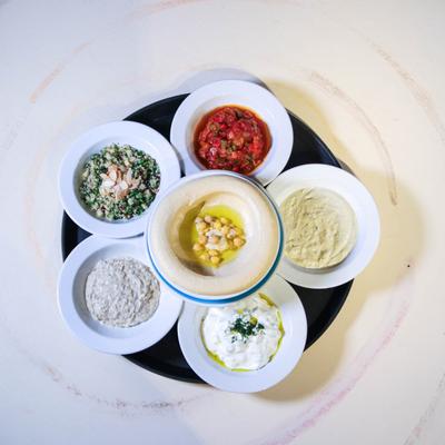 Bowls of various spreads arranged in a circle.