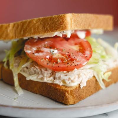 Tuna sandwich with tomato slices.