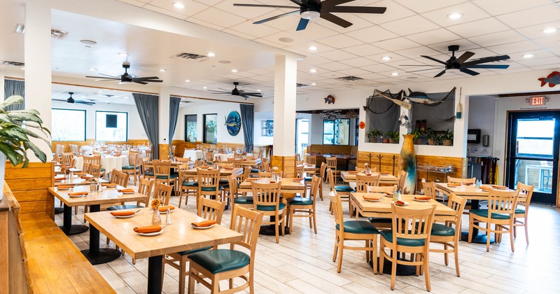 Interior, tables and chairs in dining area
