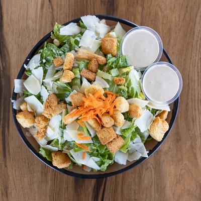 Caesar salad served with a creamy Caesar dressing.