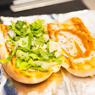 Italian Stallion sandwich being prepared on a kitchen counter, close-up.