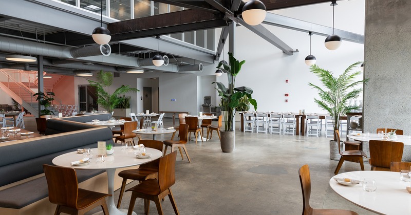 Interior, modern design of the restaurant's dining area with set dining tables