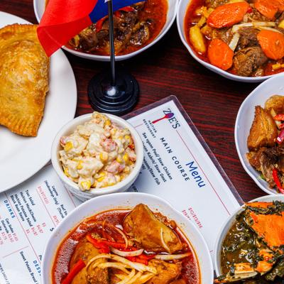 Variety of food items served on the table alongside a menu.
