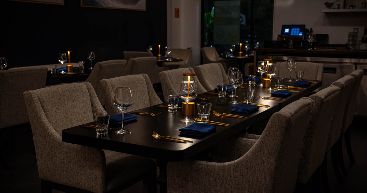 Dining room tables with candles and napkins