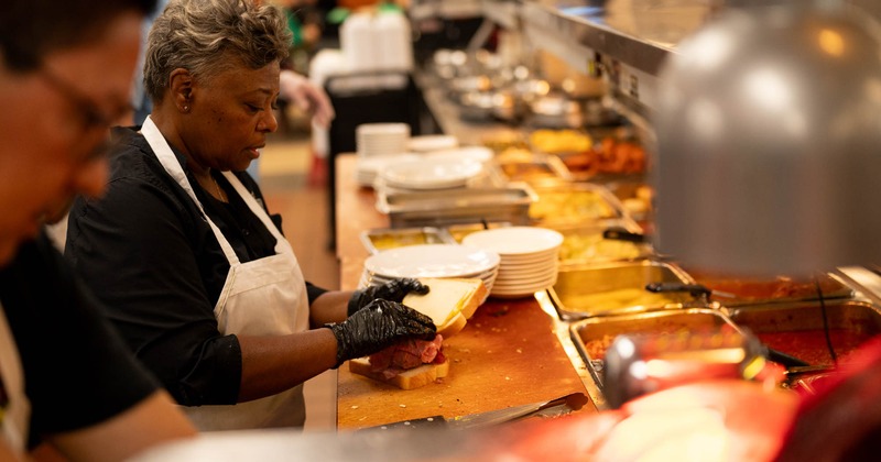 Kitchen staff member preparing food