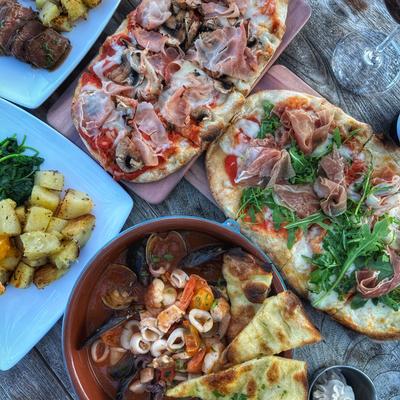 An assortment of dishes arranged on a table, overhead view.