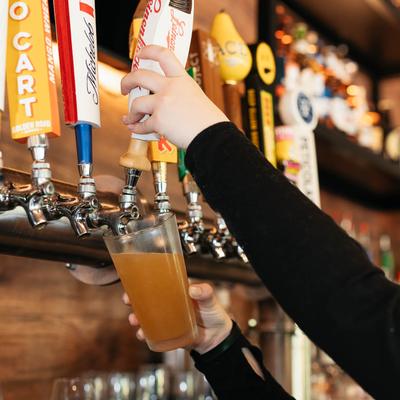 Bartender pouring draft beer.