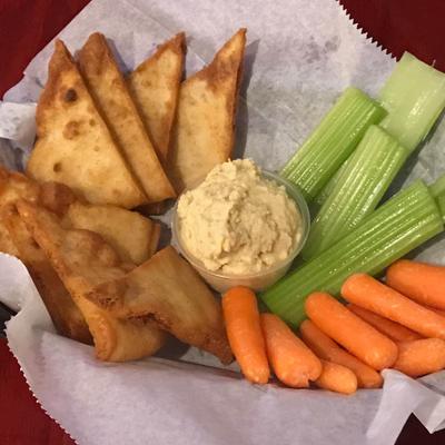 Fried pita bread, with carrots, celery, and hummus.