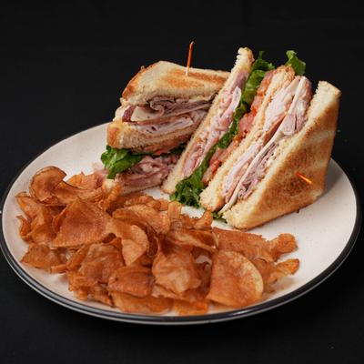 Club sandwich and potato chips.