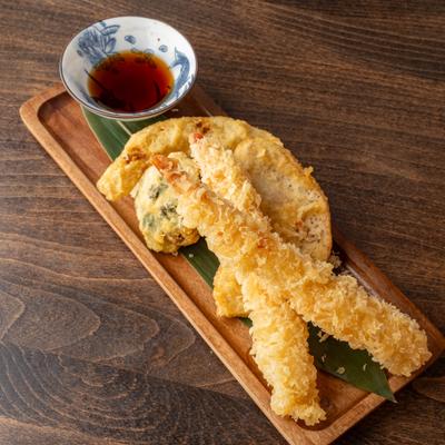 Shrimp and vegetable tempura served with soy sauce.