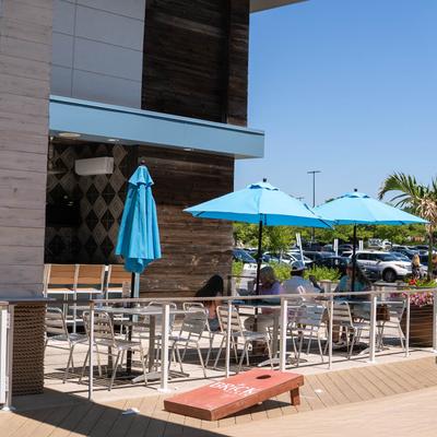 Outdoor seating area with seated guests.