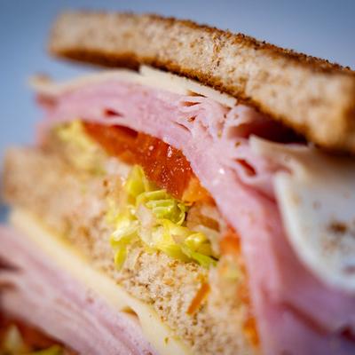 Close-up of the Ham sandwich with lettuce, cheese and tomato.