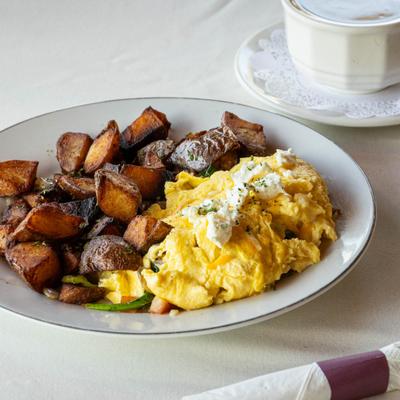 Crab Cake Benedict served with home fries.
