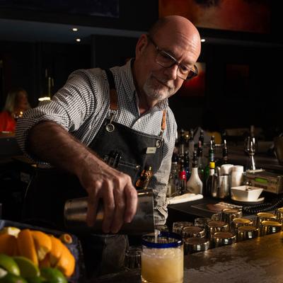A staff member pouring drinks.