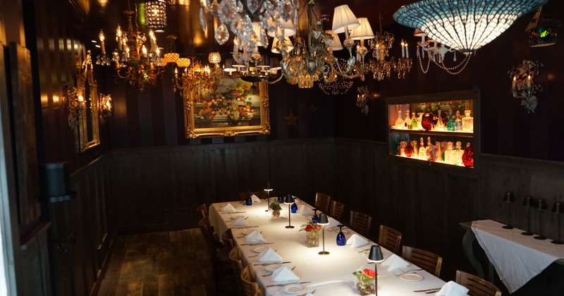 Interior, seating area with a long table with tableware