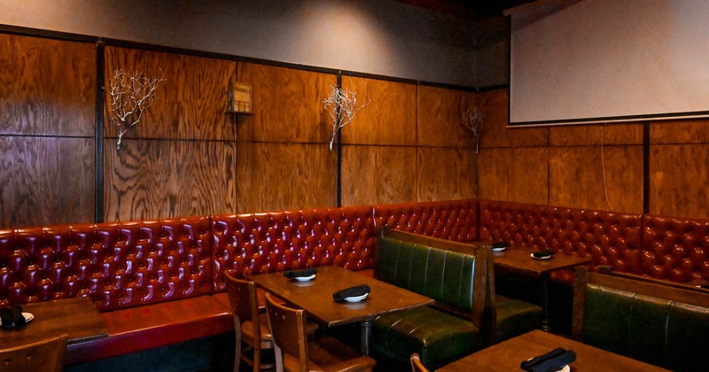 Interior, dark red and olive green booth seating area