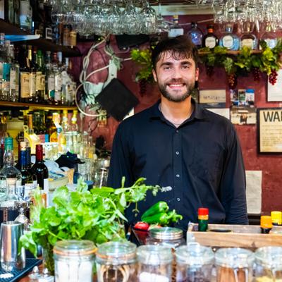 Bartender behinf the counter.
