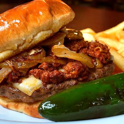 Cheeseburger topped with chorizo and caramelized onions, served with a blistered jalapeno pepper.