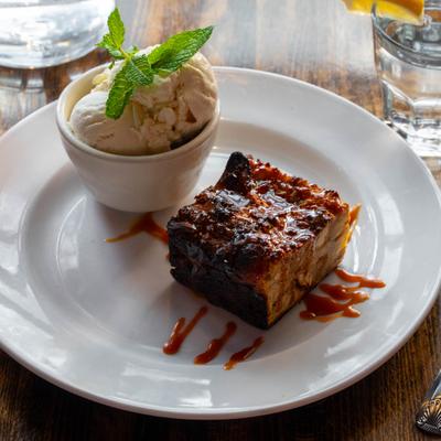 House Made Bread Pudding served with vanilla ice cream.