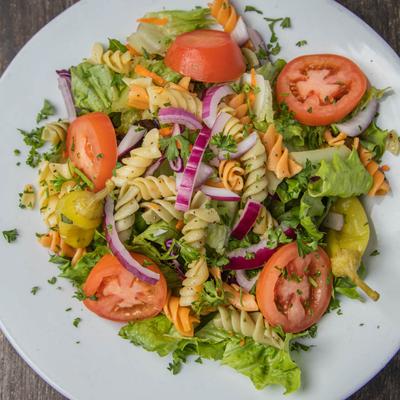 Pasta Salad with red onion, tomatoes and pepperoncini