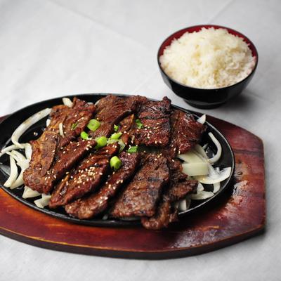 Beef Short Ribs plate with white rice on the side.