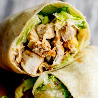 Close up shot of chicken Caesar wrap.