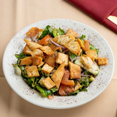 Fattoush salad with mixed greens and toasted pita chips.